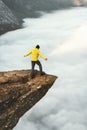 Man tourist on Trolltunga rocky cliff edge mountains Royalty Free Stock Photo