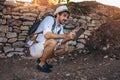 Man tourist using digital tablet in forest