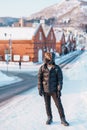Man tourist Visiting in Hakodate, Traveler in Sweater sightseeing Kanemori Red Brick Warehouse with Snow in winter. landmark and Royalty Free Stock Photo