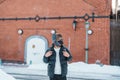 Man tourist Visiting in Hakodate, Traveler in Sweater sightseeing Kanemori Red Brick Warehouse with Snow in winter. landmark and Royalty Free Stock Photo