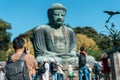 man tourist Visiting in Kamakura, Kanagawa, Japan. happy Traveler sightseeing the Great Buddha statue. Landmark and popular for Royalty Free Stock Photo