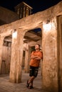 Man tourist walking in Al Seef Meraas Dubai - old historical district with traditional Arabic architecture Royalty Free Stock Photo