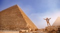 Man tourist walks background of pyramids in Giza Cairo Egypt, sun light travel banner Royalty Free Stock Photo