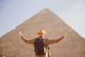 Man tourist walks background of pyramids in Giza Cairo Egypt, sun light travel banner Royalty Free Stock Photo
