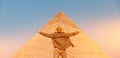 Man tourist walks background of pyramids in Giza Cairo Egypt, sun light travel banner Royalty Free Stock Photo