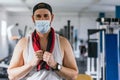 Man with a towel at the gym. Mask. Concept of health Royalty Free Stock Photo