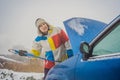 Man with towing rope hooks near towed car Royalty Free Stock Photo