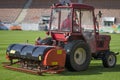 aerator machine during aerating a soccer field Royalty Free Stock Photo