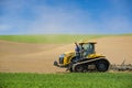 Man and Tractor in the famous Palouse region Royalty Free Stock Photo