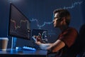 Man trader analyst at working table, analyzing financial chart, stock quotes, share prices, trading Royalty Free Stock Photo