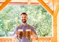 Man in traditional bavarian clothes holding mugs of beer Royalty Free Stock Photo