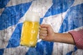 Man in traditional Bavarian shirt holds mug of beer Royalty Free Stock Photo