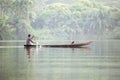 Man in Traditional Boat on Tropical River Volta in Ghana, West A Royalty Free Stock Photo