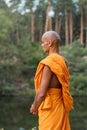 man in traditional buddhist robe meditating