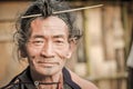 Man with traditional hairstyle in Arunachal Pradesh