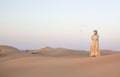 Man in traditional outfit in a desert near Dubai Royalty Free Stock Photo