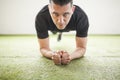 Man training on artificial grass Royalty Free Stock Photo