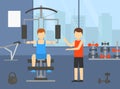 Man Training Chest Muscles on Sports Machine in Gym, Active Healthy Lifestyle, Indoor Sports with Personal Trainer