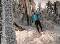 Man training downhill on frozen trail with snow