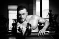 Man training with dumbbells. Dumbbell. Muscular guy exercises with dumbbells. Strong bodybuilder. Muscles with dumbbell. Royalty Free Stock Photo