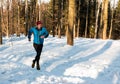 Man training on frozen trail with snow