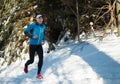 Man training on frozen trail with snow