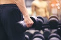 Man training hand holding dumbbells for burn fat in the body in the sport gym, Healthy lifestyle and sport concept