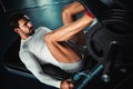 Man training legs on leg press machine Royalty Free Stock Photo