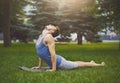 Man training yoga in cobra pose outdoors Royalty Free Stock Photo