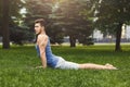 Man training yoga in cobra pose outdoors Royalty Free Stock Photo