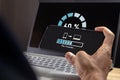 Man transfer files from mobile phone to laptop. Backup, Copy file and media or exchange data concept