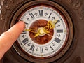 A man translates the clock hands. Time stop concept