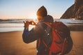 Man travel with backpack taking photo using smartphone camera blogger influencer outdoor