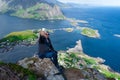 Man travel blogger taking photo by smartphone hiking in Norway, Lofoten islands Influencer lifestyle Royalty Free Stock Photo