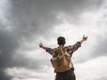 A man travel outdoor nature with storm cloudy background. Royalty Free Stock Photo