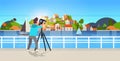 Man travel photographer taking nature picture of mountain city island guy using dslr camera on tripod landscape