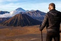 Man traveler against the Bromo volcano. Indonesia. Java island