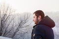 Man traveler against winter landscape