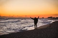 Man traveler with a backpack is standing on the beach Royalty Free Stock Photo