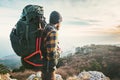 Man Traveler with big backpack hiking mountains expedition