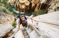 Man traveler climbing up a stepped mountain road. Spain