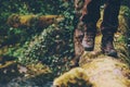 Man Traveler crossing over river on woods outdoor