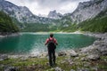 Man traveler enjoying view of Dachstein peak mountains on a Upper Gosau Lake. Gosau, Salzkammergut, Austria, Europe Royalty Free Stock Photo