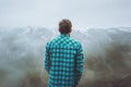 Man Traveler in foggy mountains enjoying landscape Royalty Free Stock Photo