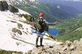 Man traveler hiking in mountains adventure solo traveling with large backpack Royalty Free Stock Photo