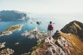 Man traveler hiking on Reinebringen mountain ridge