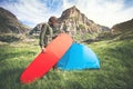 Man Traveler holding red mattress camping equipment