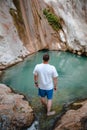man traveler looking at dimosari waterfall lake at summer time