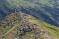 Man Traveler on mountain summit enjoying aerial view hands raised over clouds Travel Lifestyle success concept adventure active va Royalty Free Stock Photo