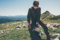 Man traveler packing backpack hiking in mountains Royalty Free Stock Photo